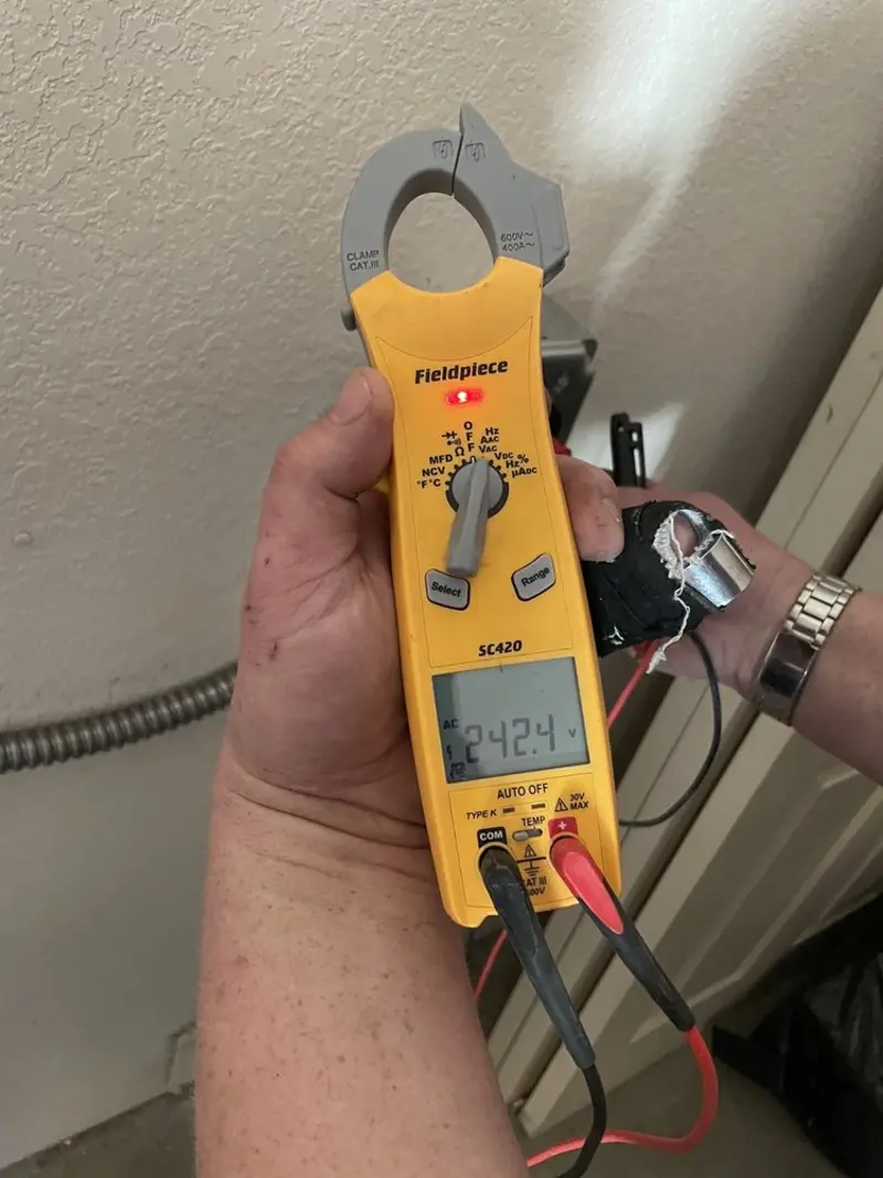 Voltage testing with clamp meter during Ceiling Fan Installation in Southbury